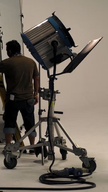 A behind-the-scenes shot of a film production set, showcasing the use of advanced technology and digital effects to bring a book adaptation to life. The image highlights the complex and technical aspects of modern filmmaking.