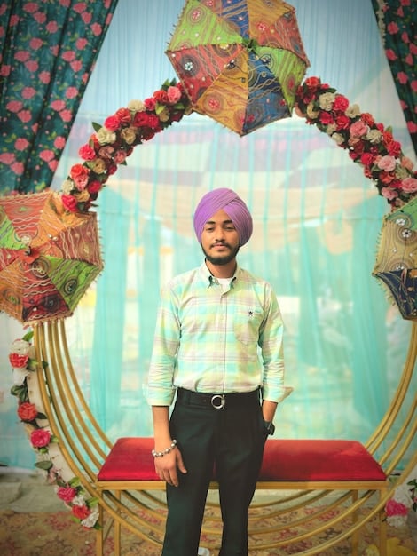 A still from a Bollywood movie showing a traditional Indian wedding scene, with vibrant colors, intricate costumes, and a large, celebratory gathering. The image highlights the cultural significance of weddings in Indian society.