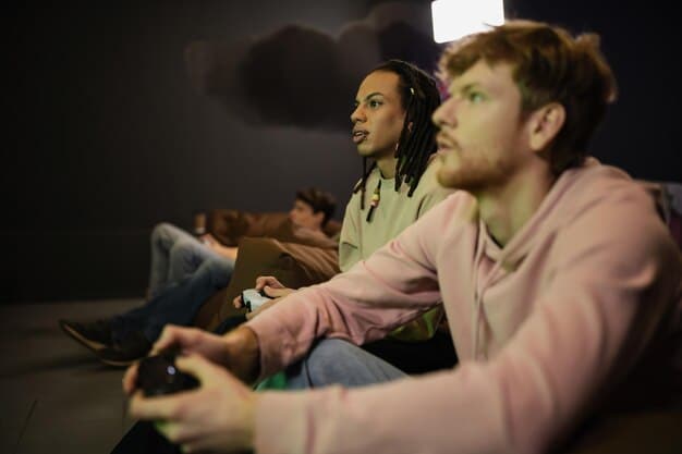 A diverse group of people are watching a film screen in a dimly lit room. Their faces are illuminated by the light of the screen, showing a range of emotions, from intrigue to sadness.