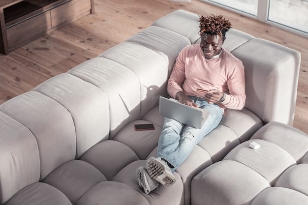A person sitting on a couch, surrounded by multiple devices: a laptop, a tablet, and a smartphone, each displaying different streaming services. The person is holding a cup of coffee and smiling, seemingly enjoying the variety of content available. Soft, warm lighting from the window creates a cozy atmosphere.