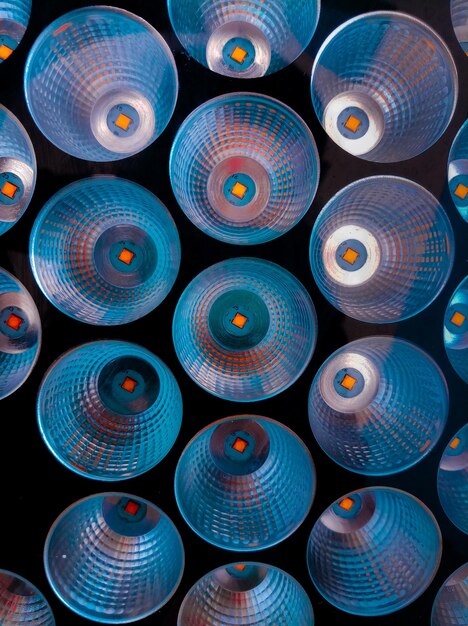 A close-up of a stack of vinyl records, showcasing a variety of colorful and artistic album covers. The focus is on the details of the artwork and the visual appeal of the collection.