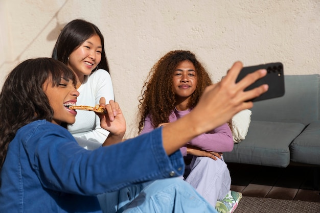 A split-screen image showing an American family in their living room, one side watching a Korean drama on Netflix and the other side participating in a TikTok dance challenge originating from Africa.