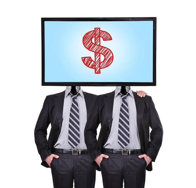 A person holding a credit card looking at a screen showing multiple streaming service logos with dollar signs superimposed. The image focus is on the streaming logos.