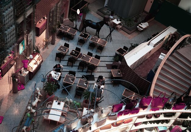A wide shot of a bustling movie set, with crew members and actors resuming work after the strike. The atmosphere is energetic and positive, symbolizing a return to normalcy for the entertainment industry.