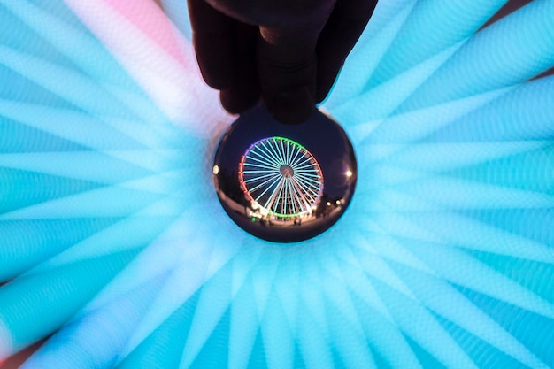 A digital illustration of a magnifying glass hovering over a concert ticket, symbolizing the intense scrutiny of government investigation.