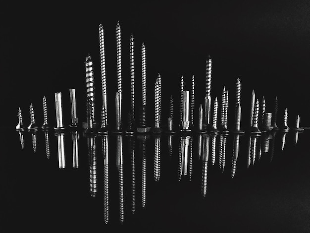 A split image, one side showing sheet music and the other side showing a waveform of an audio track, illustrating the tangible and intangible forms of music copyright.
