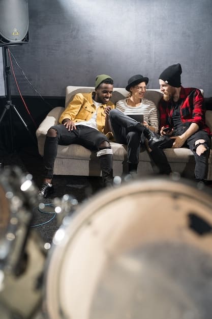A small concert venue with a few dozen people watching an indie band perform. The band is giving their all, but the venue is only partially full, representing the struggle many indie artists face in generating income from live performances.