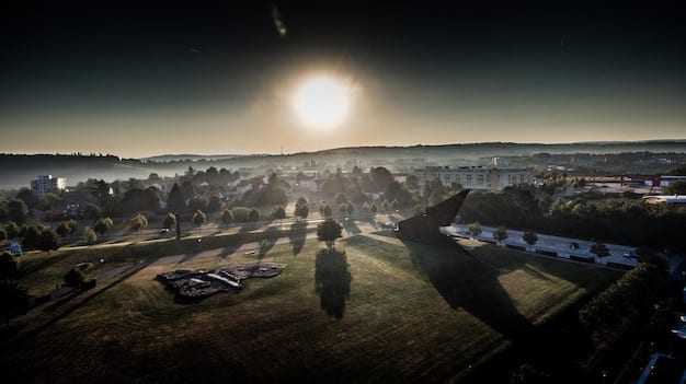 A panoramic view of a small town, revitalized by the presence of a film crew. Local businesses are thriving, and there's a sense of excitement in the air. Film equipment is visible in the background, but the focus is on the positive impact on the community.